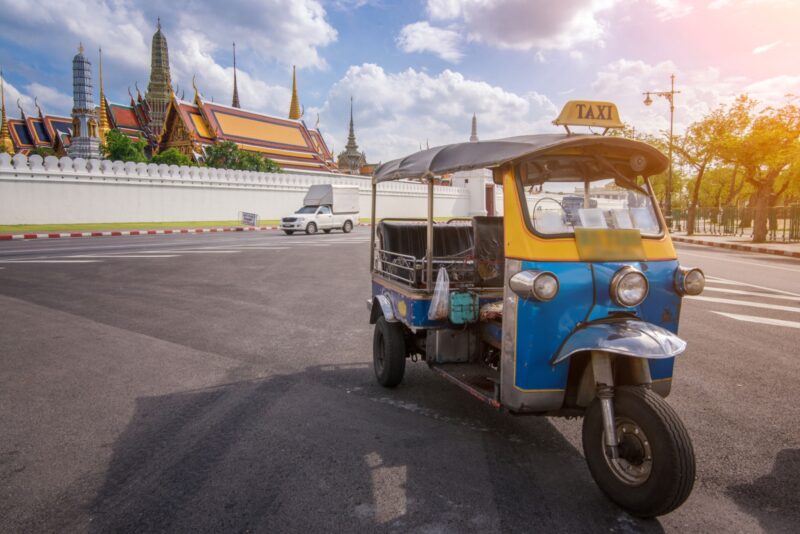 Tuk Tuk is parking in front of Wat Phra Kaeo or Grand Palace, Bangkok, Thailand.